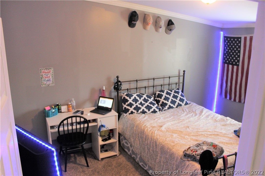 6520 Faircloth Bridge Road Stedman, NC 28391 - Photo 19 of 39 a bedroom with a bed and a chair