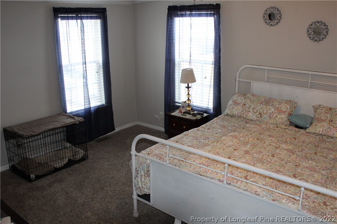 6520 Faircloth Bridge Road Stedman, NC 28391 - Photo 27 of 39 a bedroom with a bed and a window