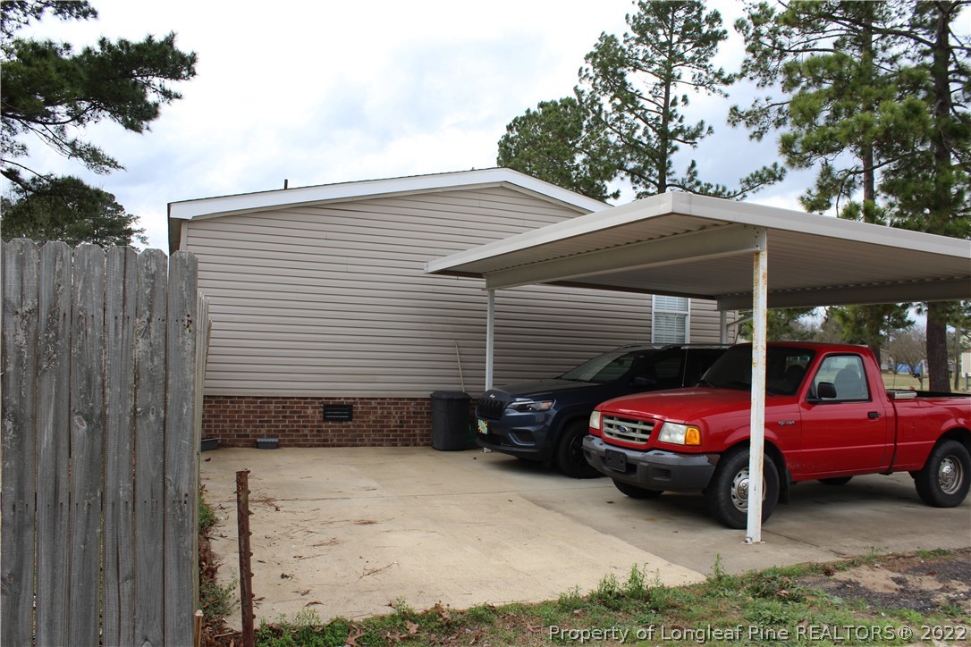 6520 Faircloth Bridge Road Stedman, NC 28391 - Photo 30 of 39 a view of a car in front of a house