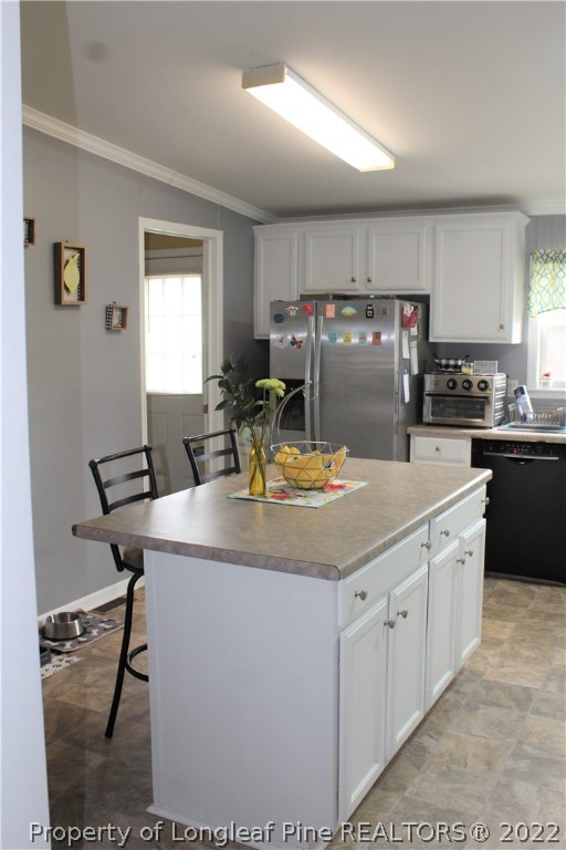 6520 Faircloth Bridge Road Stedman, NC 28391 - Photo 9 of 39 a kitchen with kitchen island granite countertop a sink and cabinets