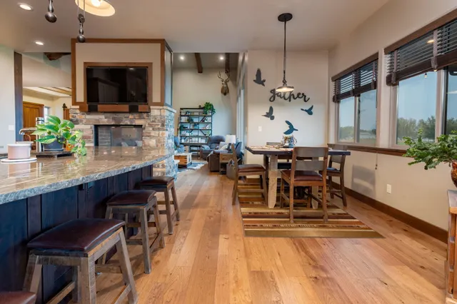 a view of a dining room with furniture window and wooden floor