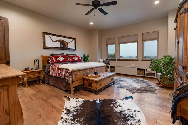 a bedroom with a bed and a table in it