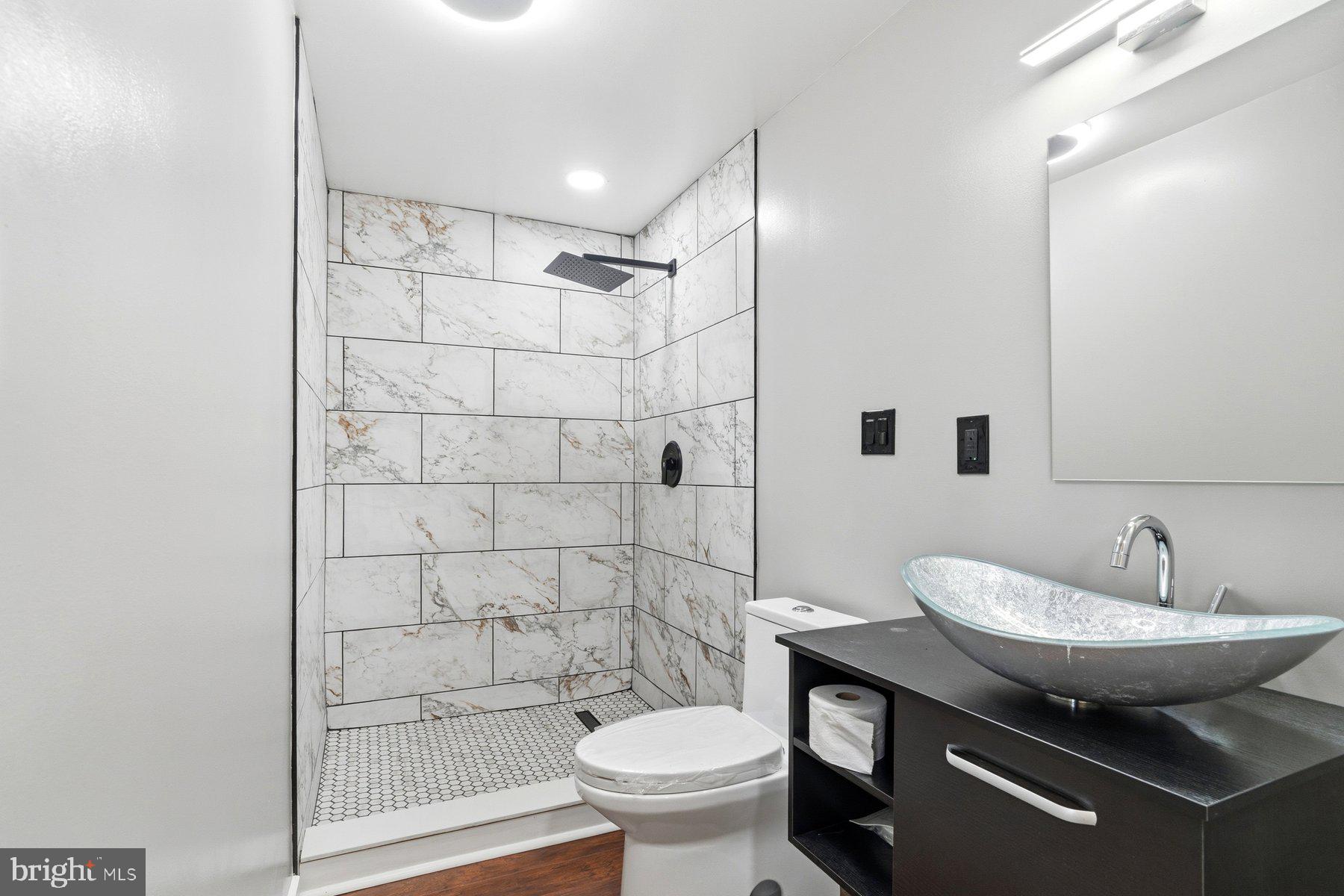 1973 Deer Park Road, Unit 3 Finksburg, MD 21048 - Photo 3 of 16 a bathroom with a sink toilet and shower