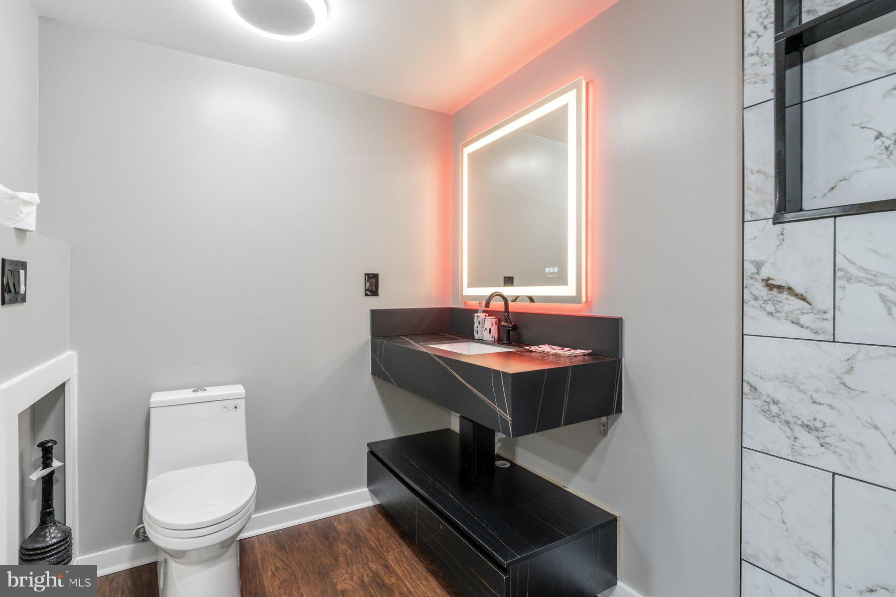 1973 Deer Park Road, Unit 3 Finksburg, MD 21048 - Photo 8 of 16 a bathroom with a sink toilet and mirror