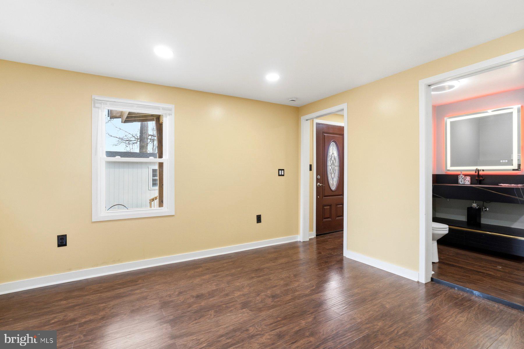 1973 Deer Park Road, Unit 3 Finksburg, MD 21048 - Photo 10 of 16 an empty room with wooden floor and windows