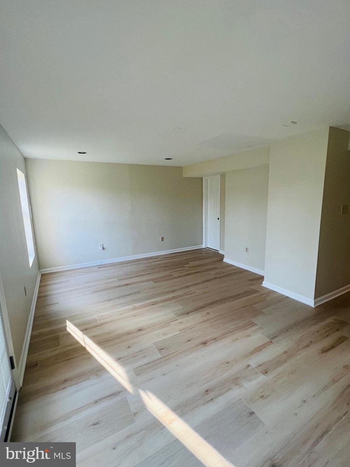 13249 # Lane Silver Spring, MD 20904 - Photo 11 of 34 an empty room with wooden floor