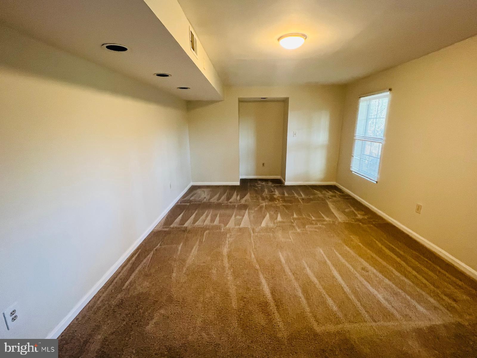 13249 # Lane Silver Spring, MD 20904 - Photo 17 of 34 a view of a big room with wooden floor and windows