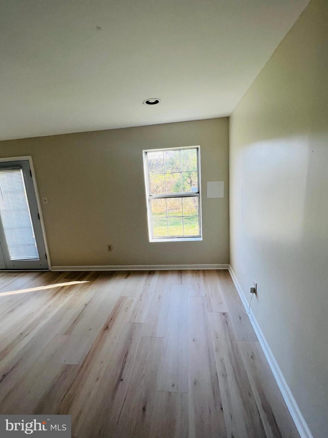 13249 # Lane Silver Spring, MD 20904 - Photo 19 of 34 an empty room with wooden floor and windows