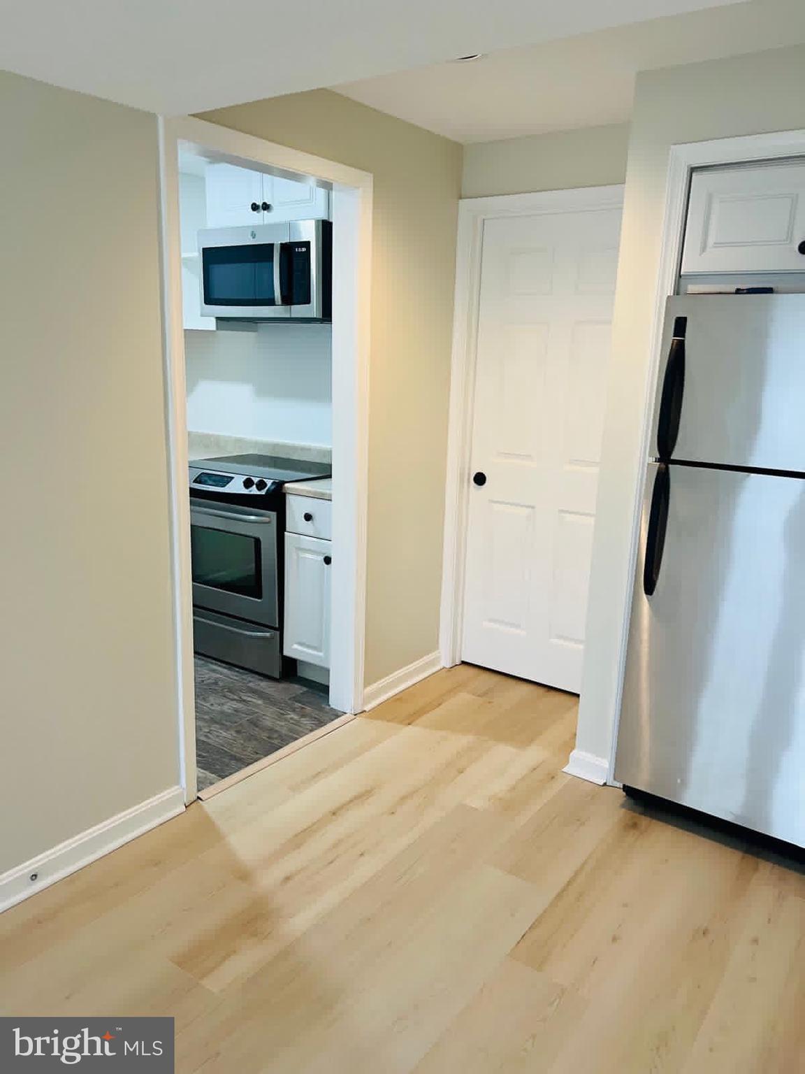 13249 # Lane Silver Spring, MD 20904 - Photo 23 of 34 a view of a kitchen with a sink and a refrigerator