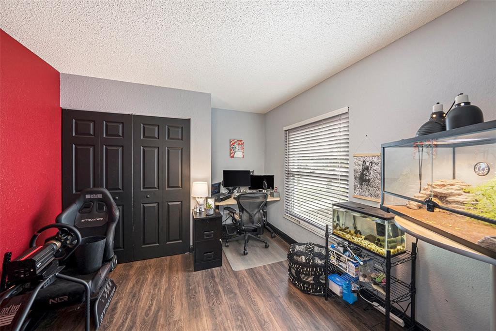 4805 Grove Point Drive Tampa, FL 33624 - Photo 12 of 35 a bedroom with furniture and a window