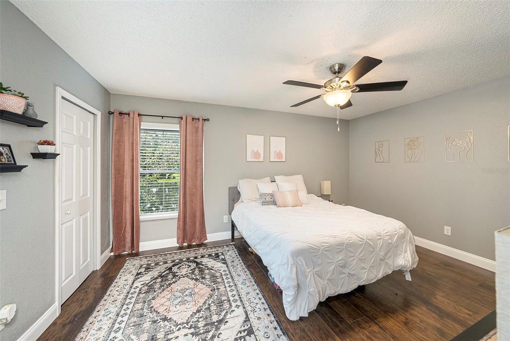 4805 Grove Point Drive Tampa, FL 33624 - Photo 15 of 35 a bedroom with a large bed and a window