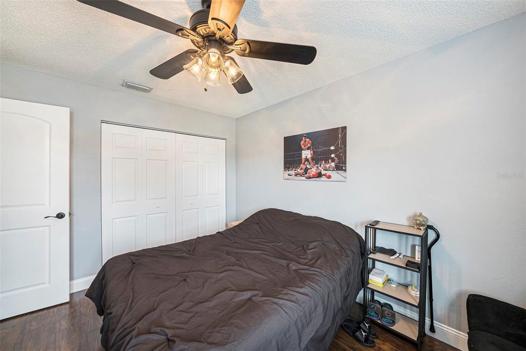 4805 Grove Point Drive Tampa, FL 33624 - Photo 23 of 35 a bedroom with a bed dresser and a window
