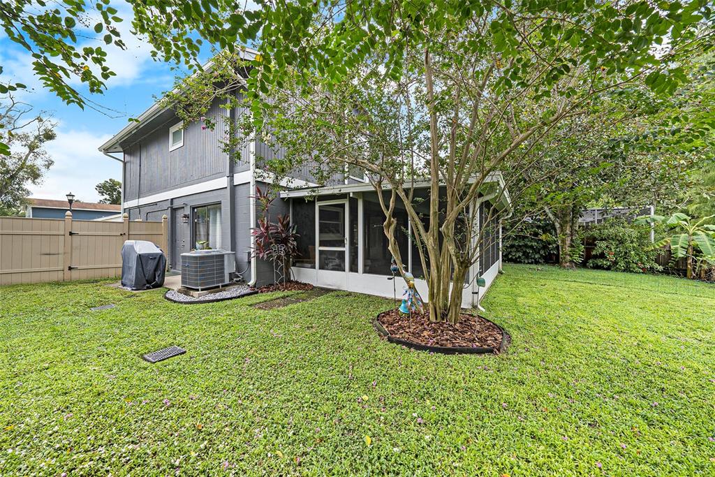 4805 Grove Point Drive Tampa, FL 33624 - Photo 26 of 35 a house view with a sitting space and garden