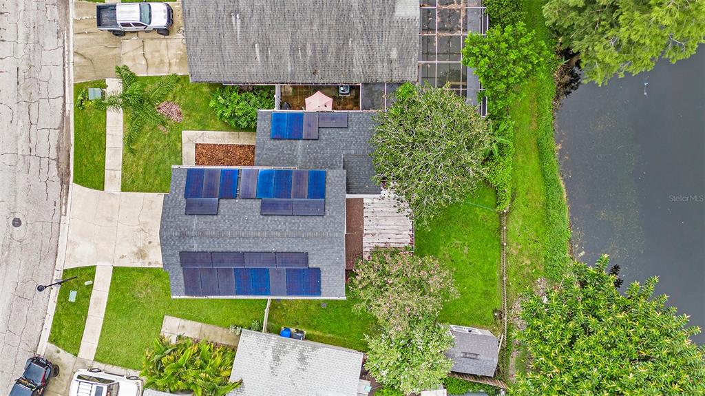 4805 Grove Point Drive Tampa, FL 33624 - Photo 29 of 35 a view of an house with backyard space and garden