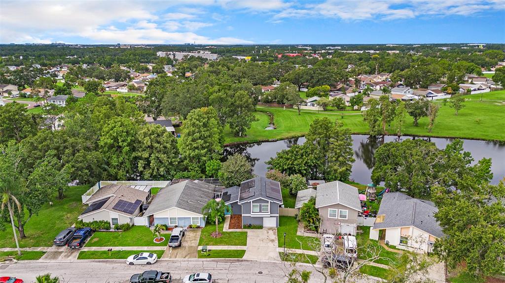 4805 Grove Point Drive Tampa, FL 33624 - Photo 31 of 35 an aerial view of residential houses with outdoor space and river