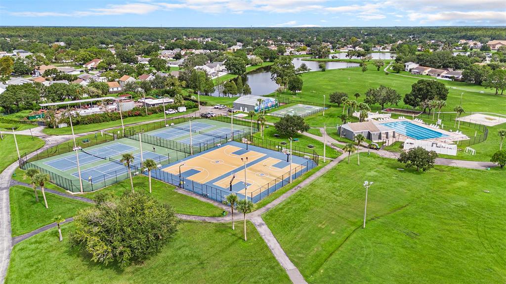 4805 Grove Point Drive Tampa, FL 33624 - Photo 32 of 35 an aerial view of residential houses with outdoor space and city view