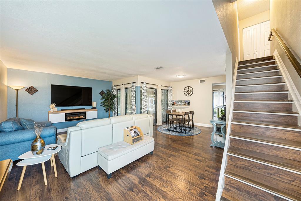 4805 Grove Point Drive Tampa, FL 33624 - Photo 4 of 35 a living room with furniture and a flat screen tv