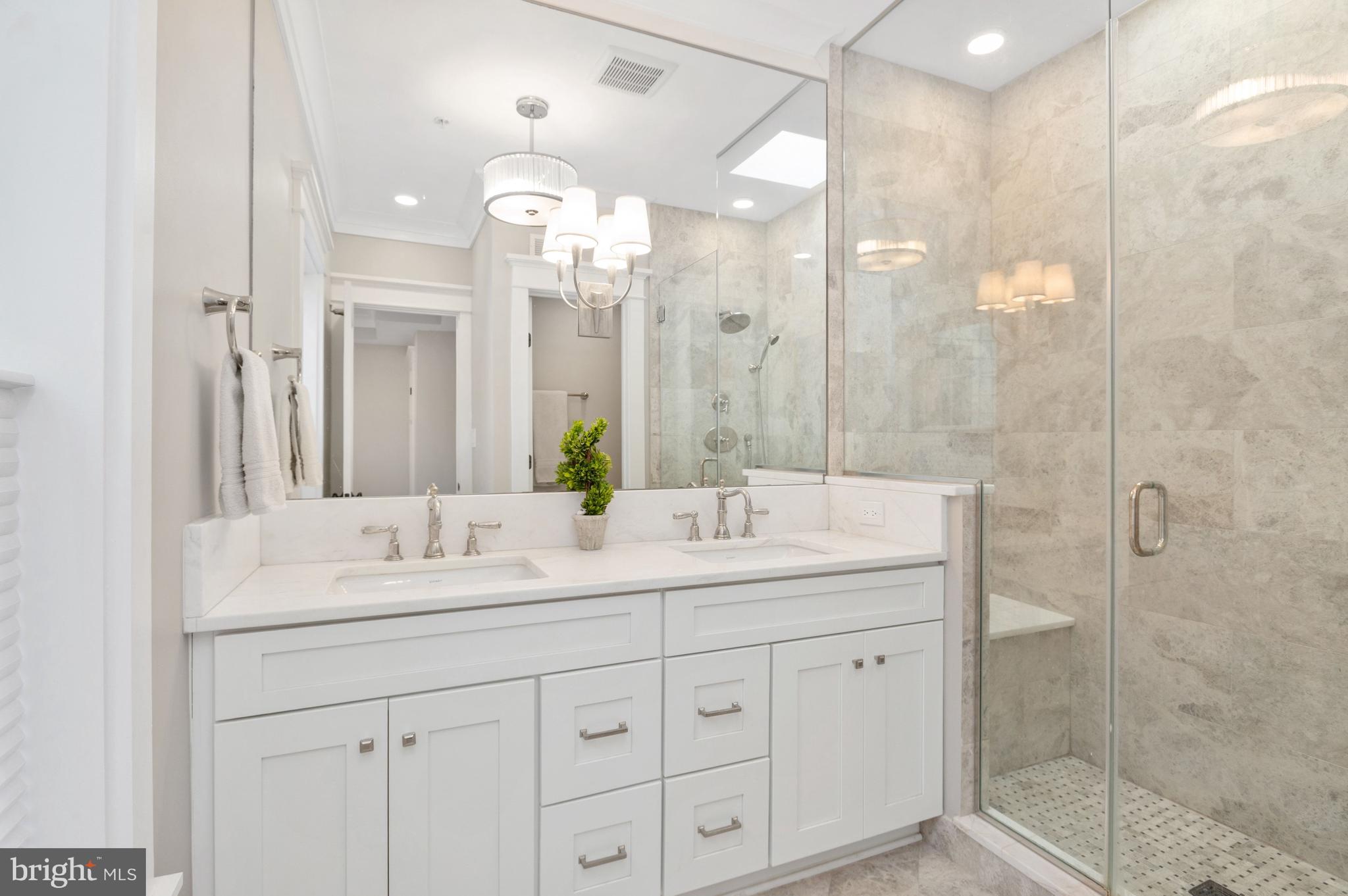 1921 35th Place Northwest, Unit 2 Washington, DC 20007 - Photo 13 of 29 Primary bath with sit-in shower, dual sinks and sk