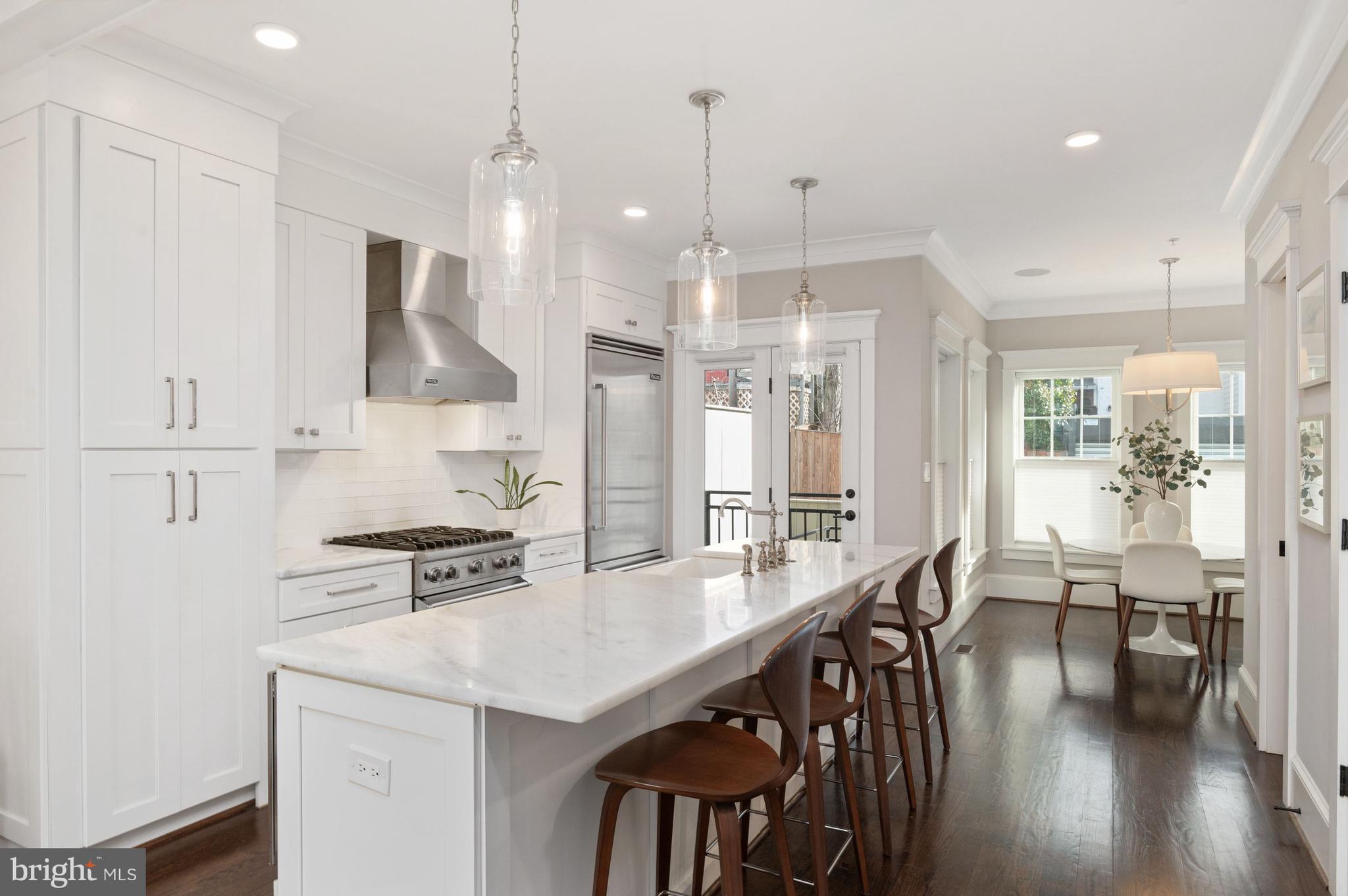 1921 35th Place Northwest, Unit 2 Washington, DC 20007 - Photo 5 of 29 Kitchen island with microwave & dishwasher