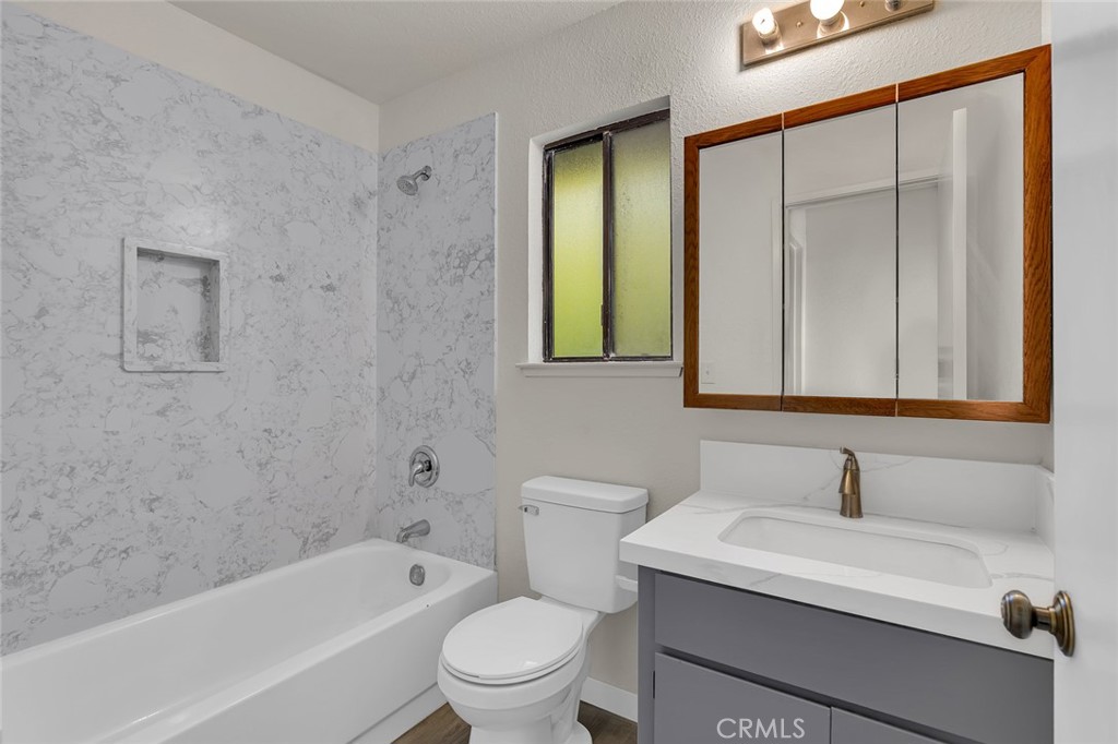 3350-74 M Street Merced, CA 95348 - Photo 21 of 55 a bathroom with a sink a toilet and shower