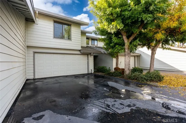 a view of a backyard with sitting area