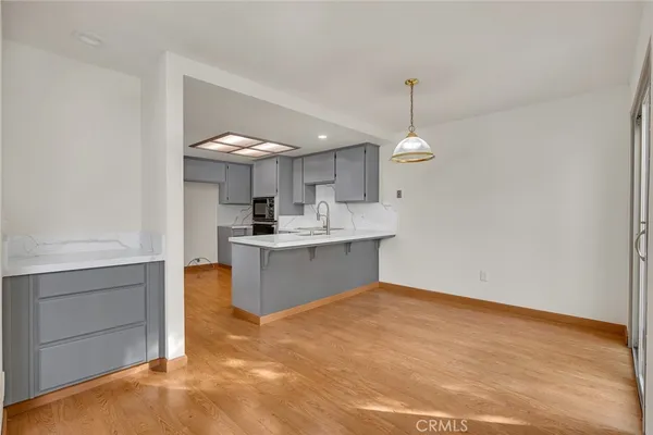 a view of a livingroom with an empty space and a fireplace