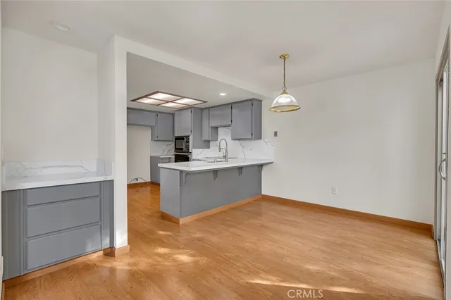 a view of a livingroom with an empty space and a fireplace