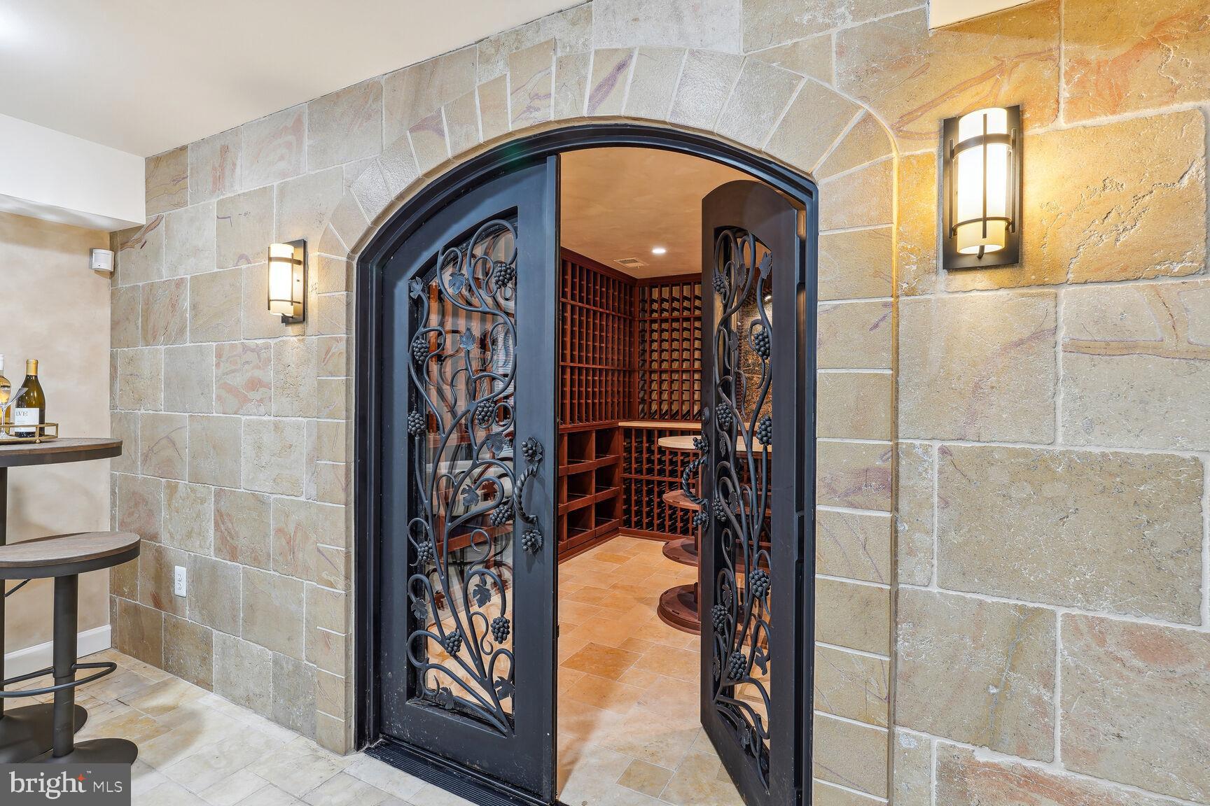 12313 Riding Fields Road Rockville, MD 20850 - Photo 20 of 42 Steel doors to wine cellar and Travertine walls &