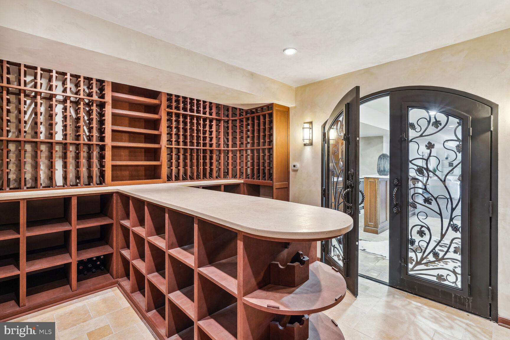 12313 Riding Fields Road Rockville, MD 20850 - Photo 22 of 42 Tasting bar, travertine countertop an & floors