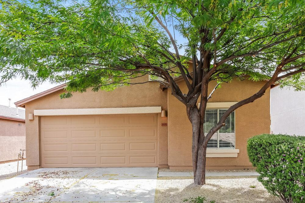 30559 North Nightingale Road San Tan Valley, AZ 85143 - Photo 1 of 16 a front view of a house with a tree