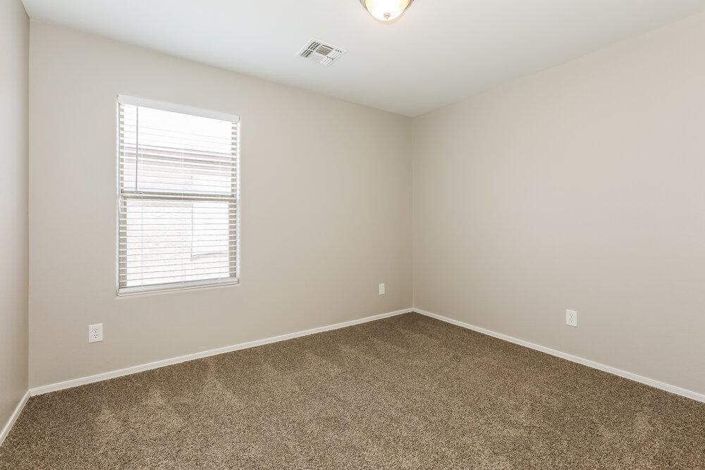 30559 North Nightingale Road San Tan Valley, AZ 85143 - Photo 13 of 16 an empty room with a window