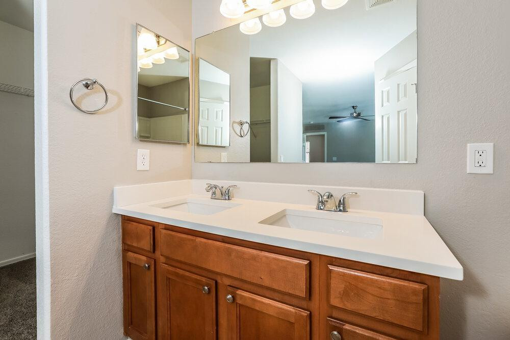 30559 North Nightingale Road San Tan Valley, AZ 85143 - Photo 14 of 16 a bathroom with a sink and a mirror