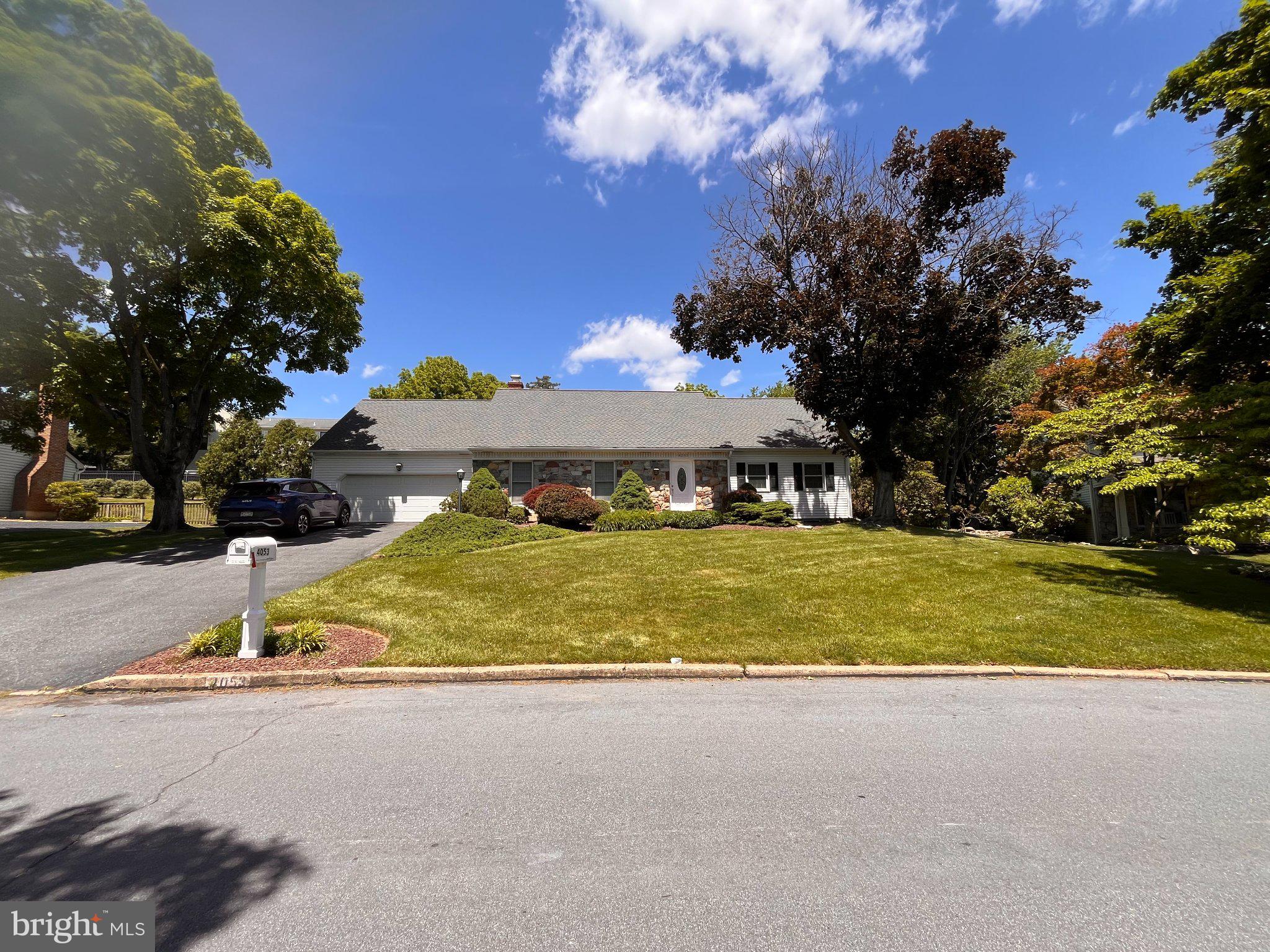 4053 Wedgewood Road Allentown, PA 18104 - Photo 3 of 8 Charming home with lush greenery.