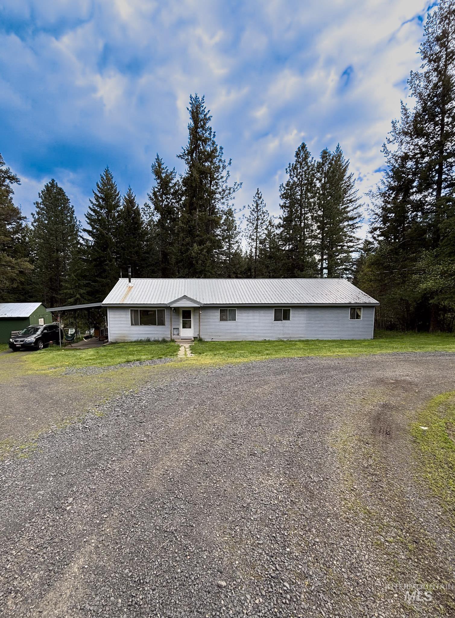 1650 Wells Bench Road Orofino, ID 83544 - Photo 2 of 44 Single-story residence featuring a light-colored exterior and a metal roof