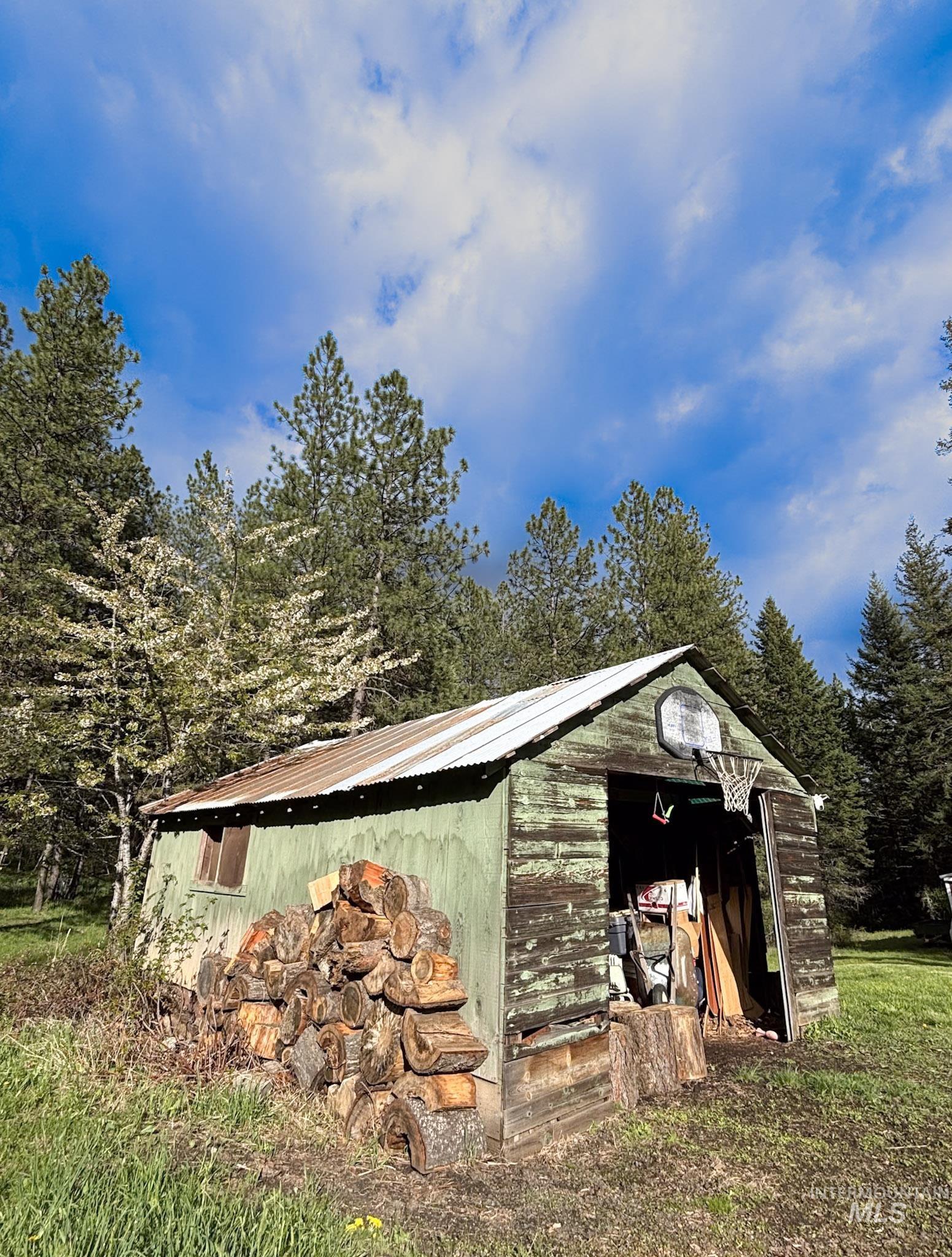 1650 Wells Bench Road Orofino, ID 83544 - Photo 34 of 44 Outbuilding featuring a corrugated metal roof and wood siding
