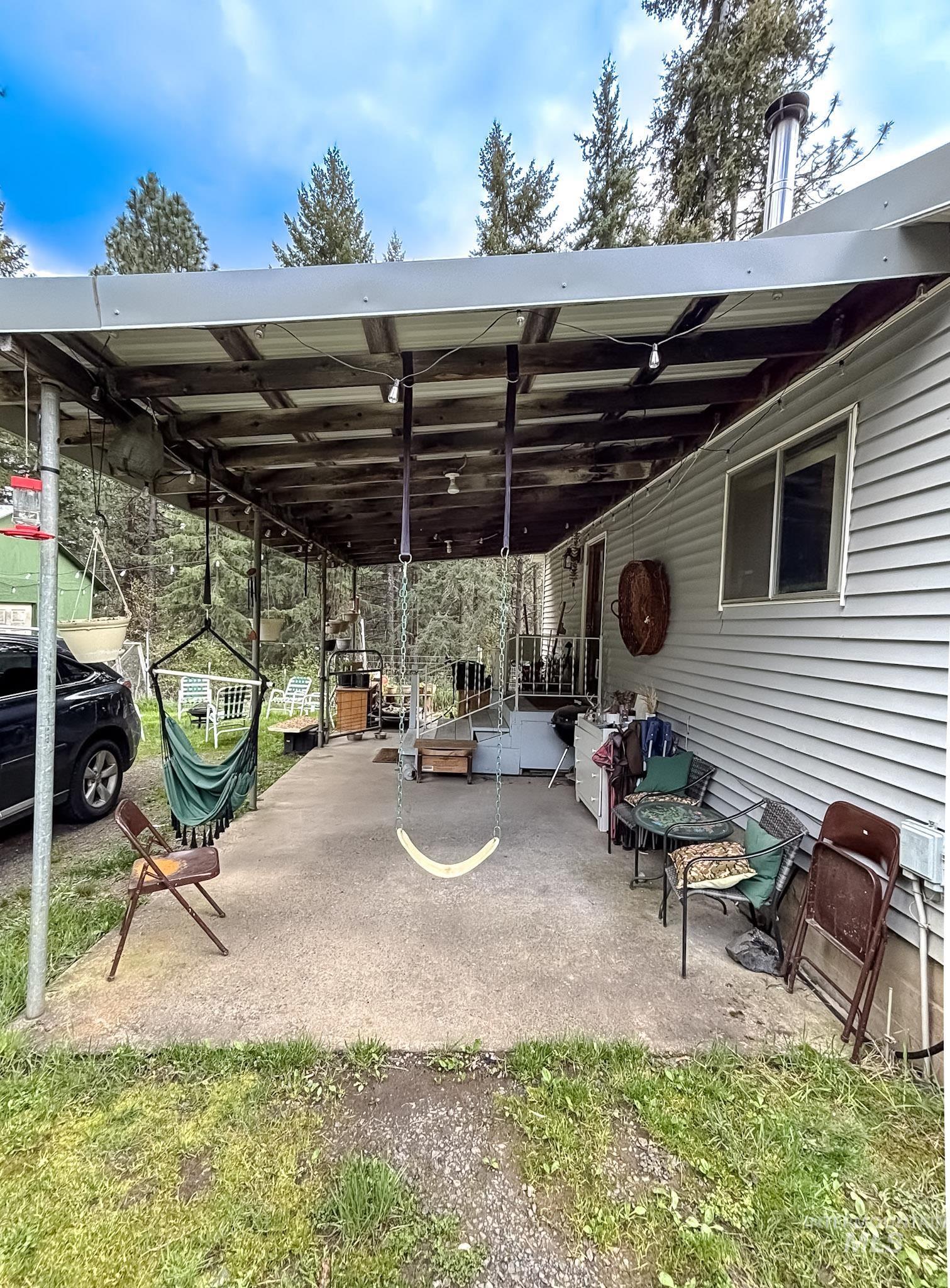 1650 Wells Bench Road Orofino, ID 83544 - Photo 4 of 44 Covered patio featuring a concrete slab and string lighting