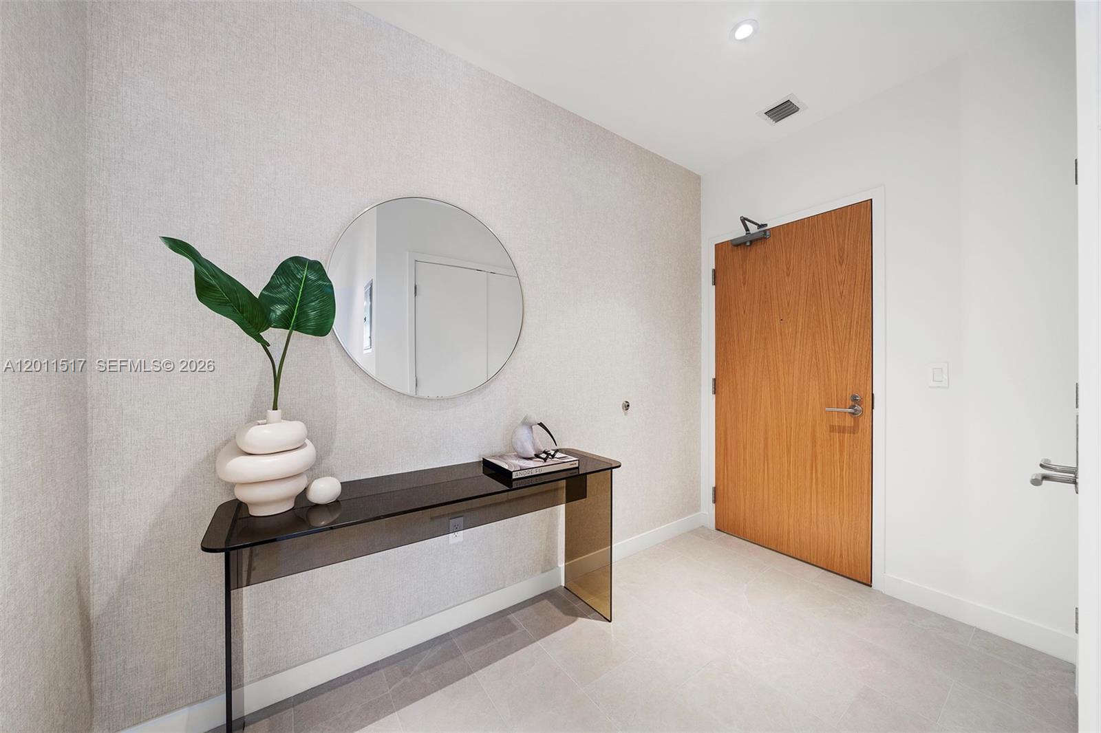 500 Alton Road, Unit 501 Miami Beach, FL 33139 - Photo 1 of 14 a living room with furniture and a potted plant