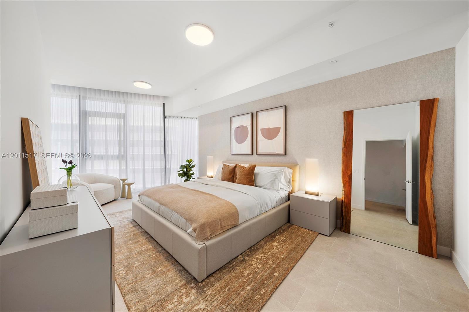 500 Alton Road, Unit 501 Miami Beach, FL 33139 - Photo 12 of 14 a bedroom with a bed and a couch