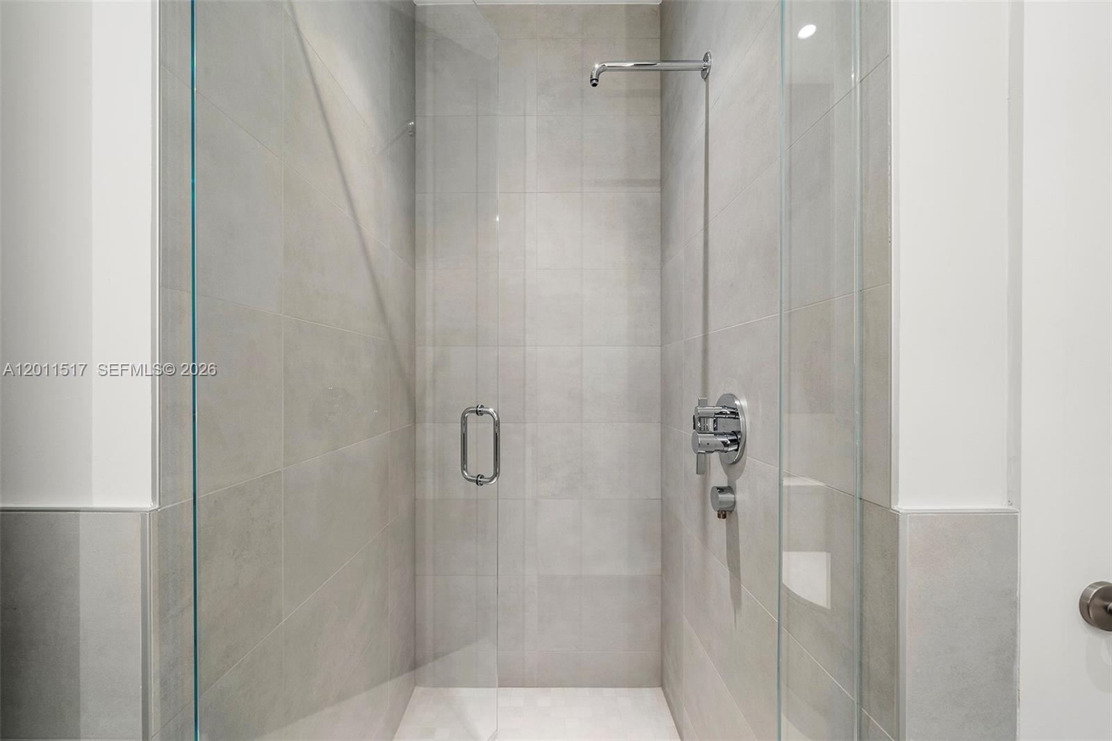 500 Alton Road, Unit 501 Miami Beach, FL 33139 - Photo 4 of 14 a bathroom with a glass shower door