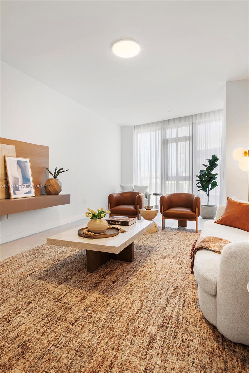 500 Alton Road, Unit 501 Miami Beach, FL 33139 - Photo 10 of 14 a living room with furniture and a large window