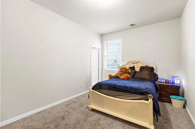 a room with a bed and a window