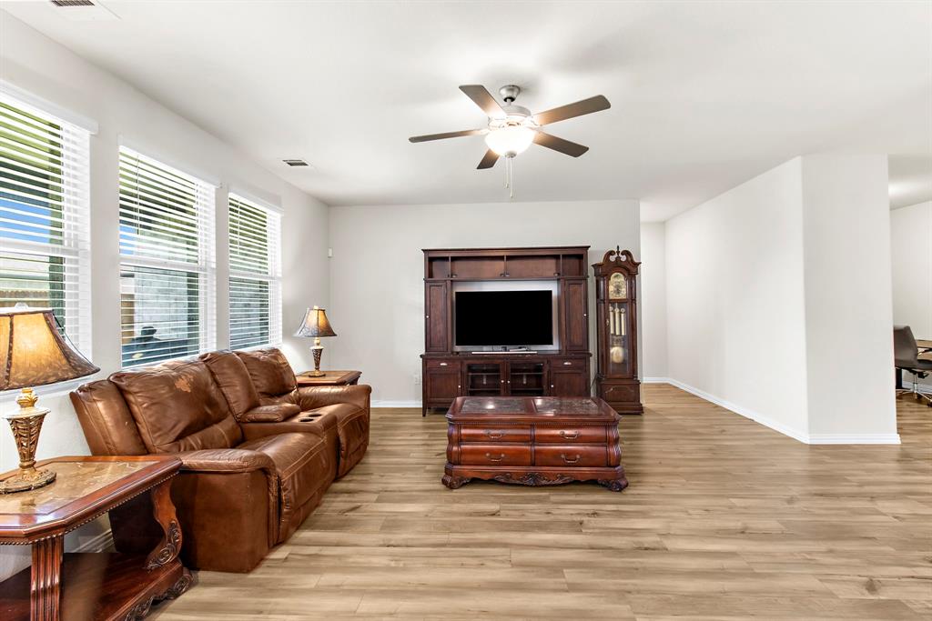 1211 Sweetleaf Street Melissa, TX 75454 - Photo 21 of 37 a living room with furniture and a flat screen tv