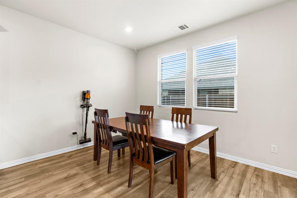 1211 Sweetleaf Street Melissa, TX 75454 - Photo 28 of 37 a view of a dining room with furniture and wooden floor
