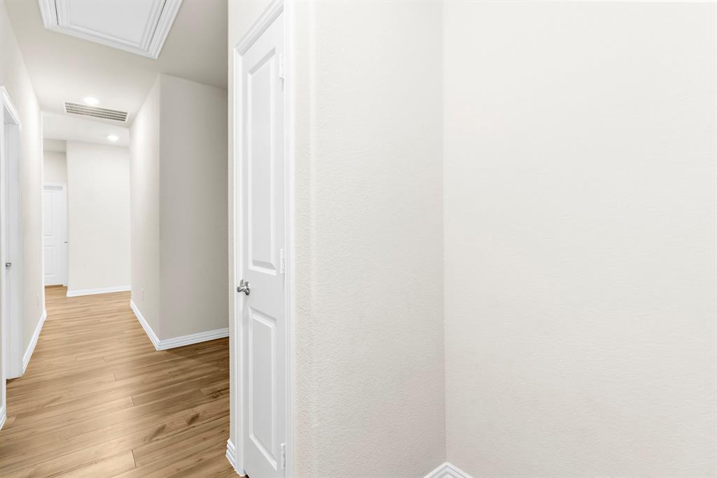1211 Sweetleaf Street Melissa, TX 75454 - Photo 9 of 37 a view of a hallway with wooden floor
