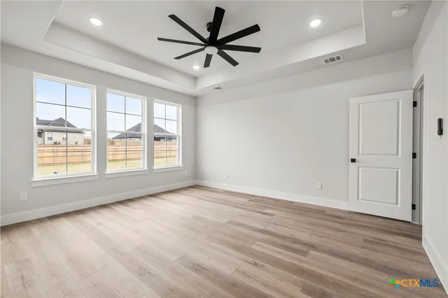 a spacious bathroom with a bathtub and a shower