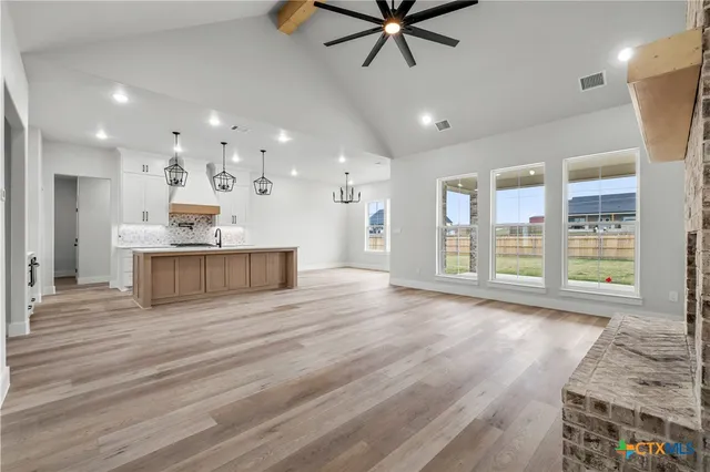a view of a kitchen with a sink and a window