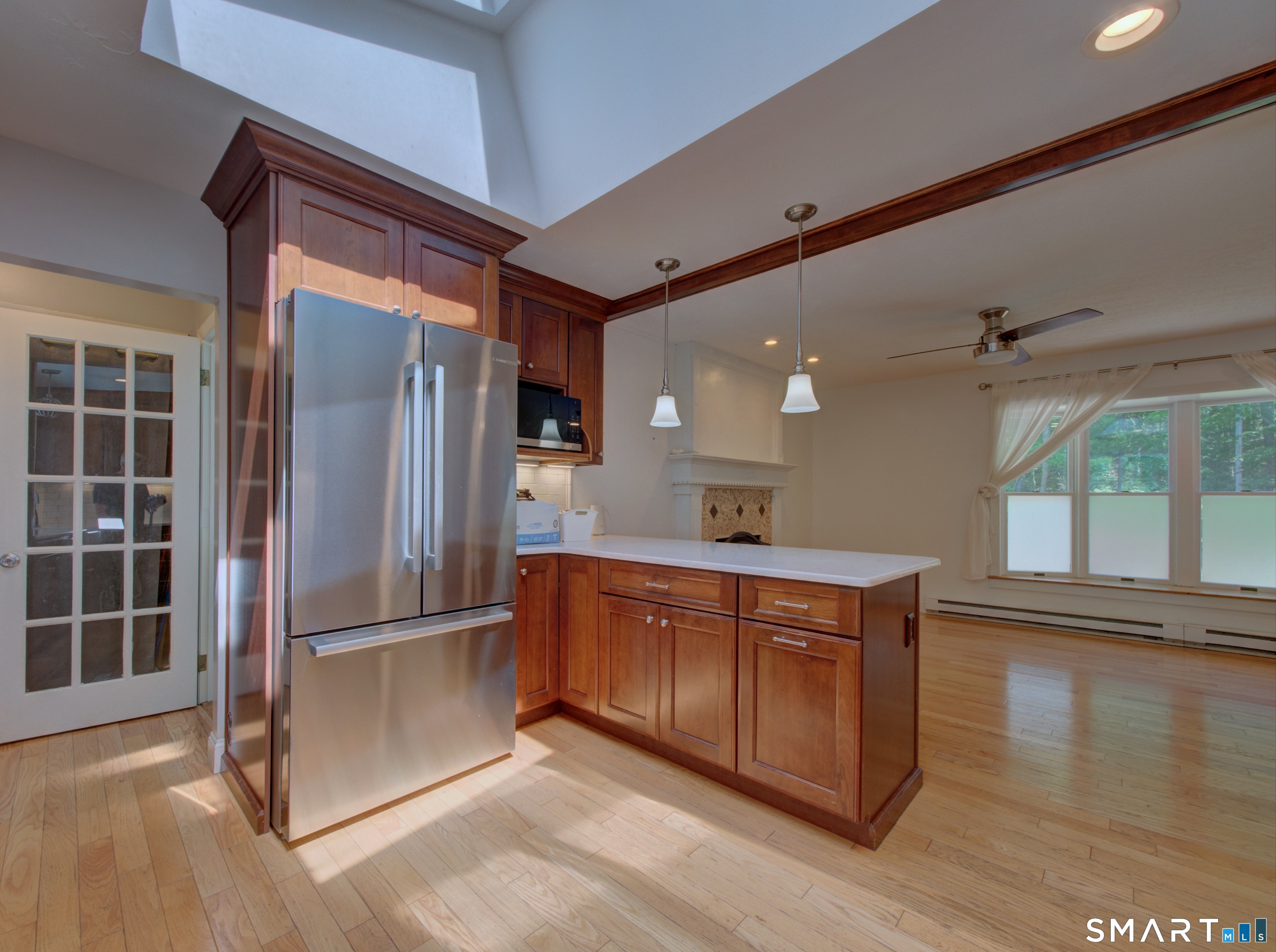 311 Sandy Hollow Road Groton, CT 06355 - Photo 3 of 26 a kitchen with stainless steel appliances granite countertop a refrigerator a sink and a stove