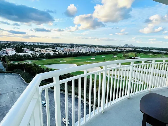 a view of a garden with wooden fence