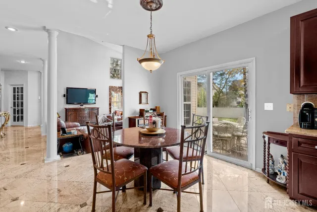 a view of a dining room with furniture window and outside view