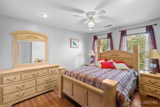 a bedroom with a bed and a dresser